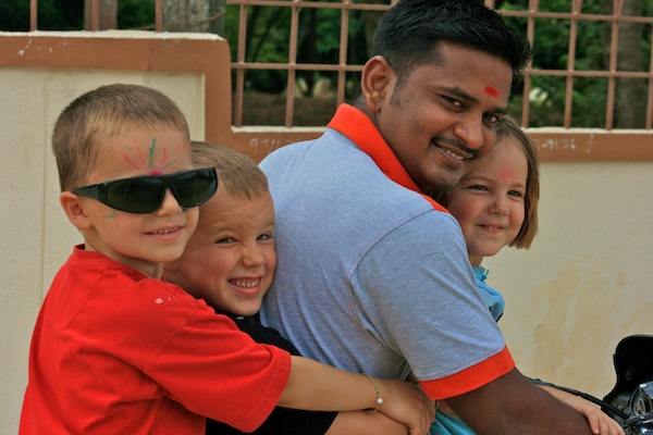 Vel on motorcycle with kids
